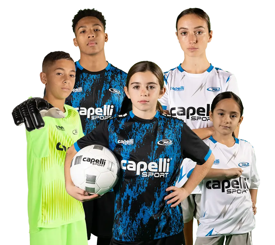 Five youth soccer players wearing Capelli Sport uniforms exude confidence as they pose against a white background. One player holds a soccer ball while another sports goalkeeper gloves, embodying the question: Why Rush Soccer?